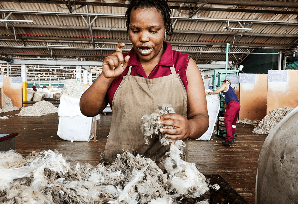 lady working with wool using sign language